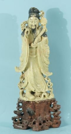 ANTIQUE SOAPSTONE CHINESE FIGURE OF A WEALTHY MAN: ANTIQUE SOAPSTONE CHINESE FIGURE OF A WEALTHY MAN ON RED STONE BASE. Height: 14 1/2 in. by Width: 6 in. by Depth: 4 in.
