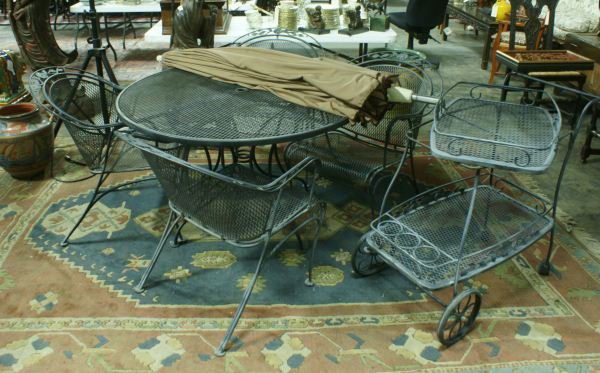 SEVEN-PIECE PATIO SET BY WOODARD: SEVEN-PIECE PATIO SET BY WOODARD. TABLE, 4 CHAIRS, BAR CART AND AN UMBRELLA. Height: 28 and 32 in. by Width: 48 and 26 in. by Depth: 48 and 32 in.