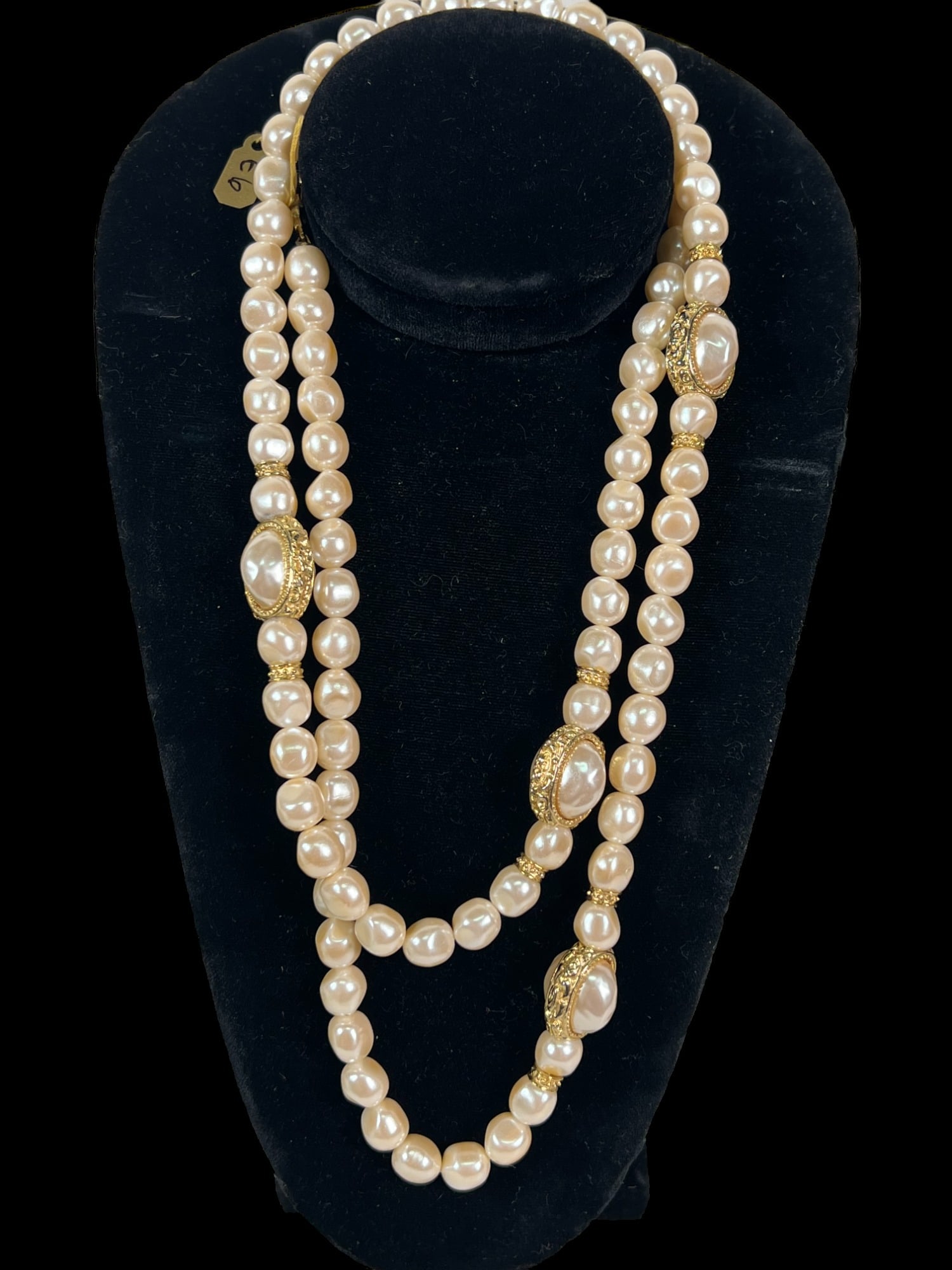 42 INCH STRAND OF 94 IRREGULAR SHAPED PEARLS: 42 INCH STRAND OF 94 IRREGULAR SHAPED PEARLS HAS 8 GOLD COLORED SPACERS & 4 DOUBLE SPACERS.
