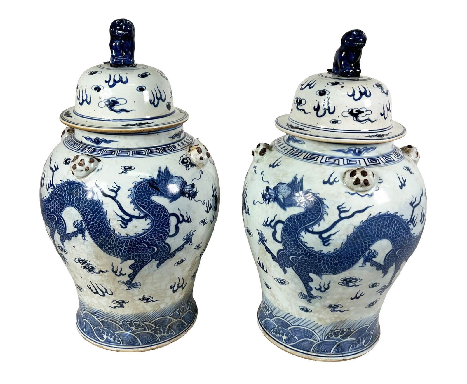 PAIR OF BLUE & WHITE PORCELAIN DRAGON TEMPLE JARS: PAIR OF BLUE & WHITE PORCELAIN DRAGON TEMPLE LIDDED JARS. Height: 24 in. by Width: 13 in.