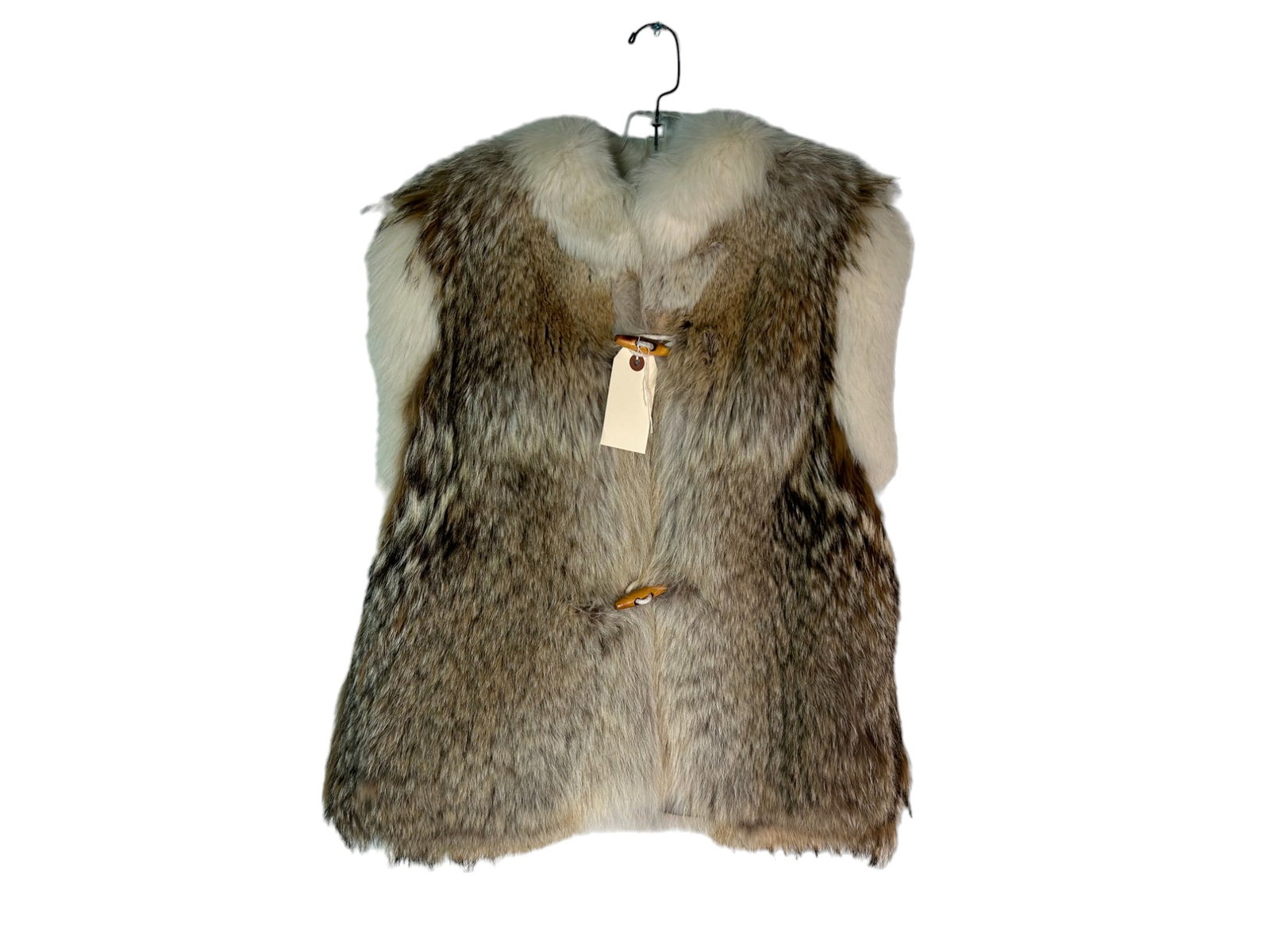 COYOTE VEST WITH WHITE FOX TRIM: COYOTE VEST WITH WHITE FOX TRIM LENGTH: 23" LABEL: SAKOWITZ SIZE: SMALL