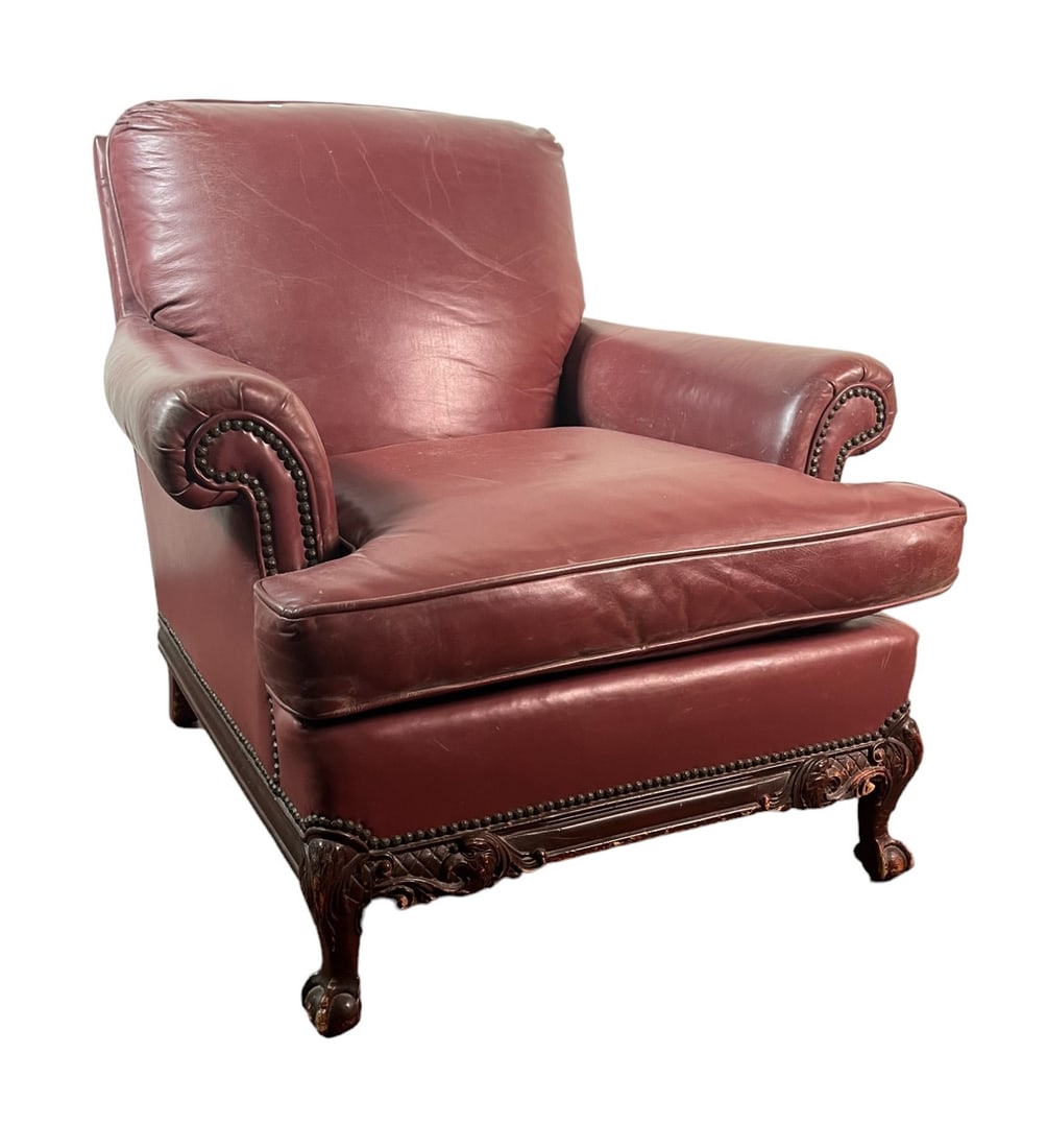VINTAGE LEATHER LOUNGE CHAIR W NAILHEAD TRIM: VINTAGE LEATHER LOUNGE CHAIR W NAILHEAD TRIM ON WOOD CARVED BALL AND CLAW FEET. Height: 32 in. by Width: 38 in. by Depth: 37