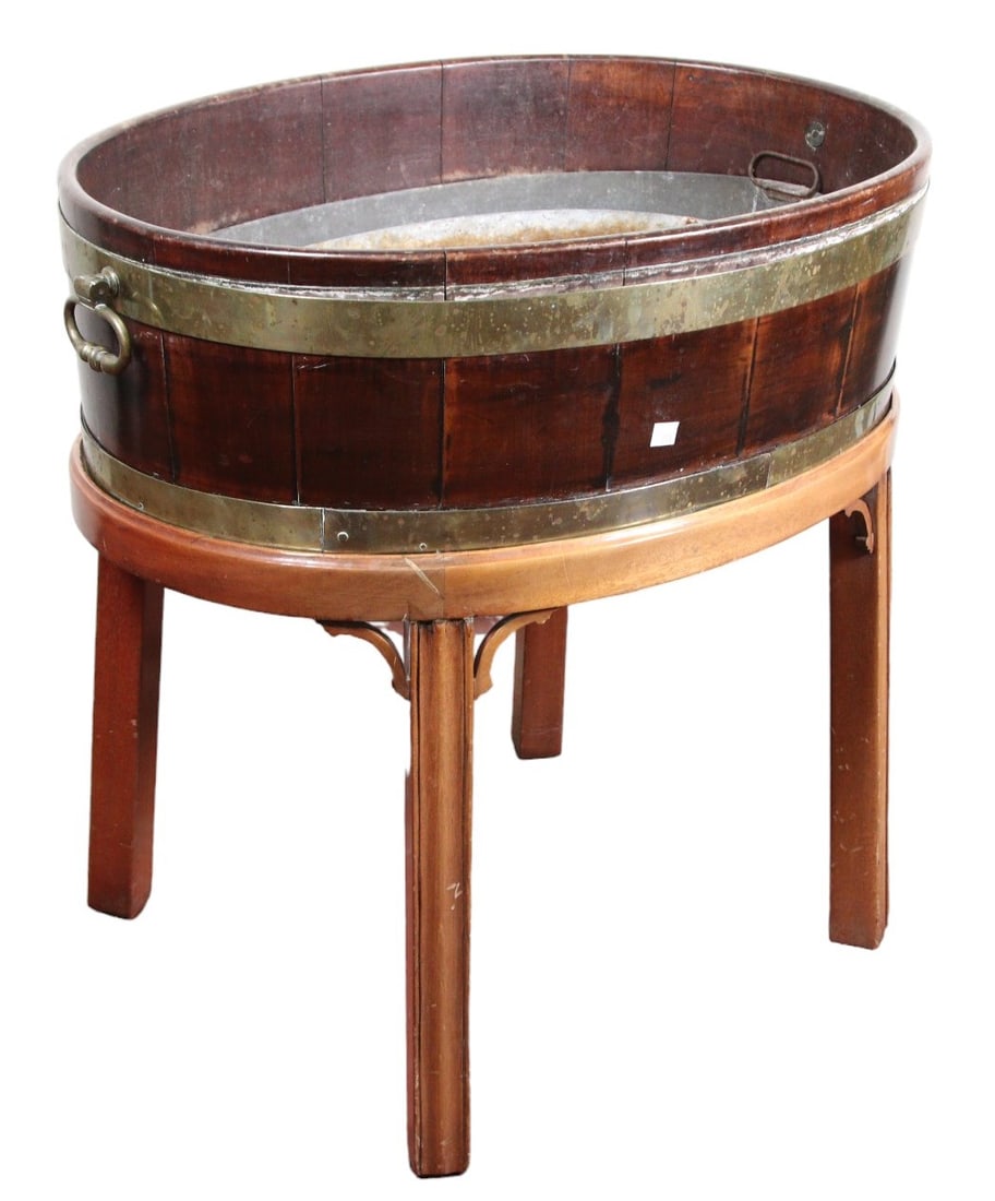 GEORGIAN OAK AND BRASS OVAL OPEN WINE COOLER: GEORGIAN OAK AND BRASS OVAL OPEN WINE COOLER. Height: 27 in. by Width: 27.5 in. by Depth: 20