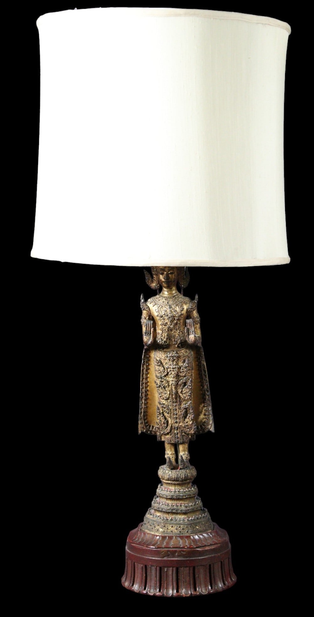 ANTIQUE GILT BRONZE THAI RATTANAKOSIN LAMP: ANTIQUE GILT BRONZE / HAND PAINTED THAI RATTANAKOSIN LAMP A BUDDHA STATUE CONVERTED TO A LAMP Height: 36 in. by Width: 8 in. by Depth: 8 in. Buddha is 22". Base is 4".