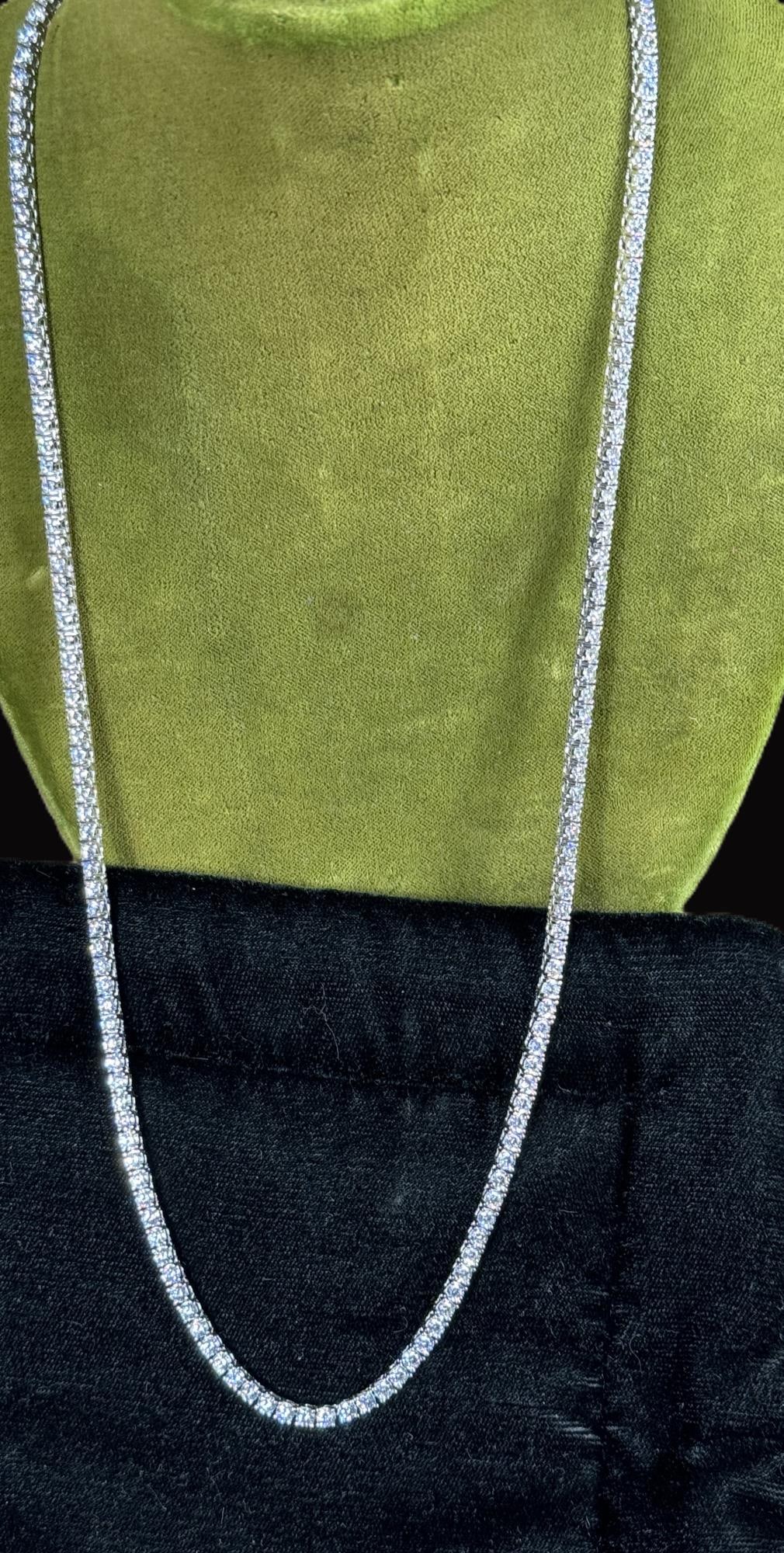CZ DIAMOND OPERA LENGTH NECKLACE: CZ DIAMOND OPERA LENGTH NECKLACE IN STERLING SILVER. 22". Height: 22