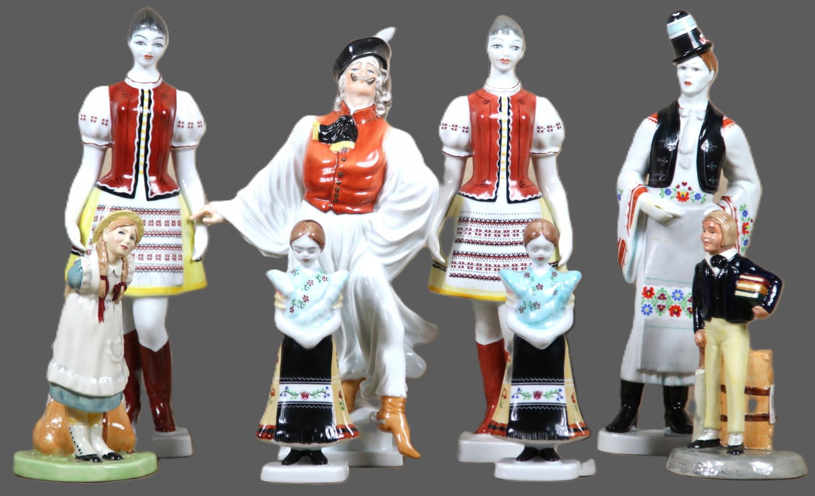 HUNGARIAN HAND PAINTED PORCELAIN FIGURES: HUNGARIAN HAND PAINTED PORCELAIN FIGURES. Height: 12 in. by Width: 4 in. by Depth: 3 in.