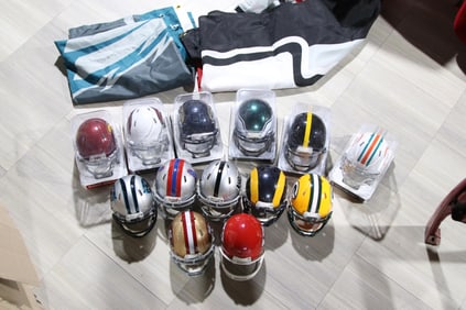 LOT OF MINI HELMETS.