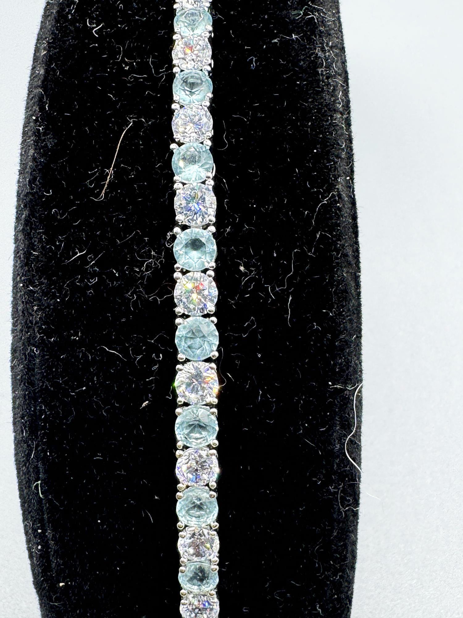 AQUAMARINE AND STERNING TENNIS BRACELET: AQUAMARINE AND STERNING TENNIS BRACELET