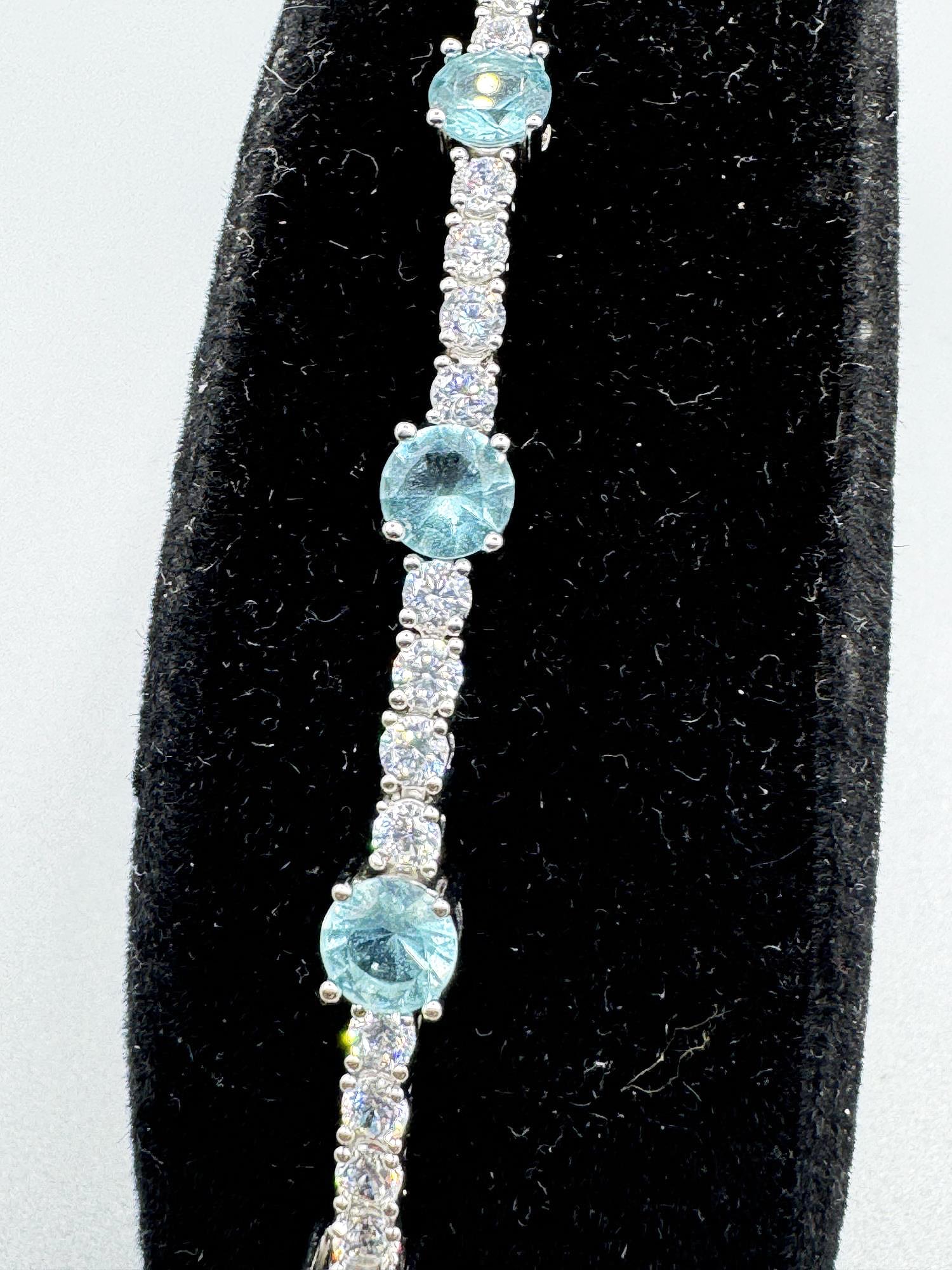 AQUAMARINE AND STERNING TENNIS BRACELET: AQUAMARINE AND STERNING TENNIS BRACELET