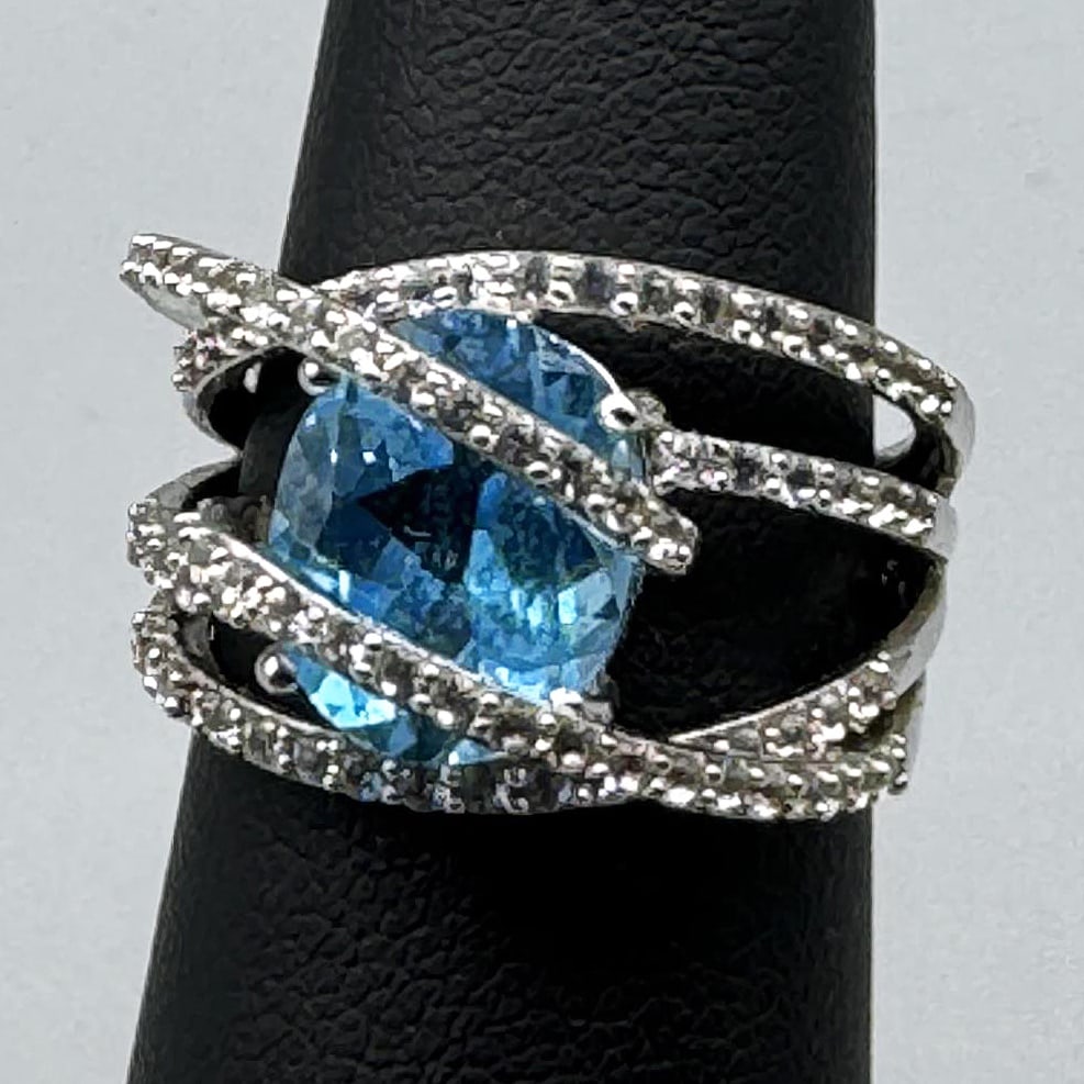 BLUE TOPAZ AND DIA WRAPPED RING STERLING: BLUE TOPAZ AND DIA WRAPPED RING STERLING SIZE 7