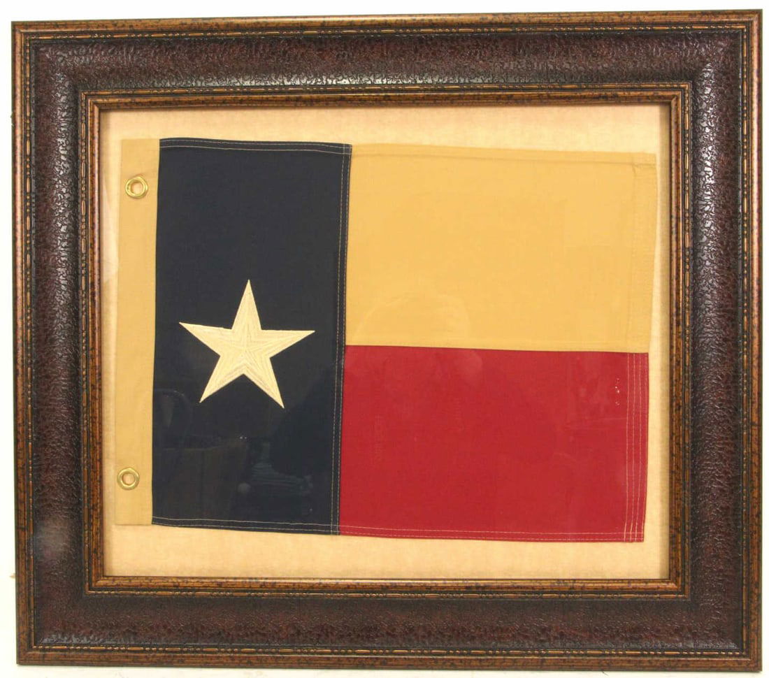 DECORATIVE FRAMED HAND STITCHED TEXAS FLAG: DECORATIVE FRAMED HAND STITCHED TEXAS FLAG. Height: 27 in. by Width: 31 in. by Depth: 1 in.