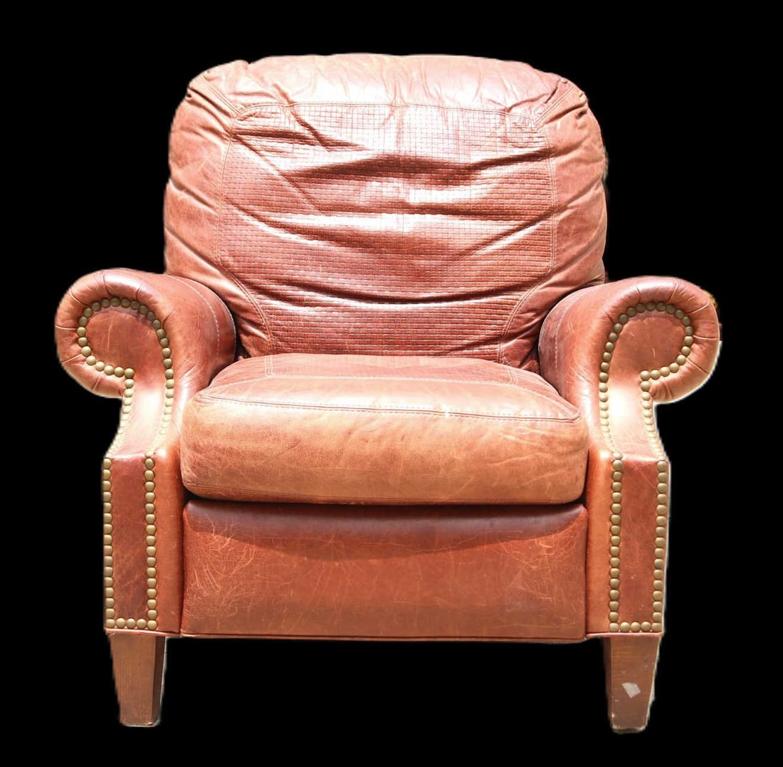 BROWN LEATHER RECLINER BY MOTIONCRAFT: BROWN LEATHER RECLINER BY MOTIONCRAFT. Height: 38 in. by Width: 39 in. by Depth: 42 in.