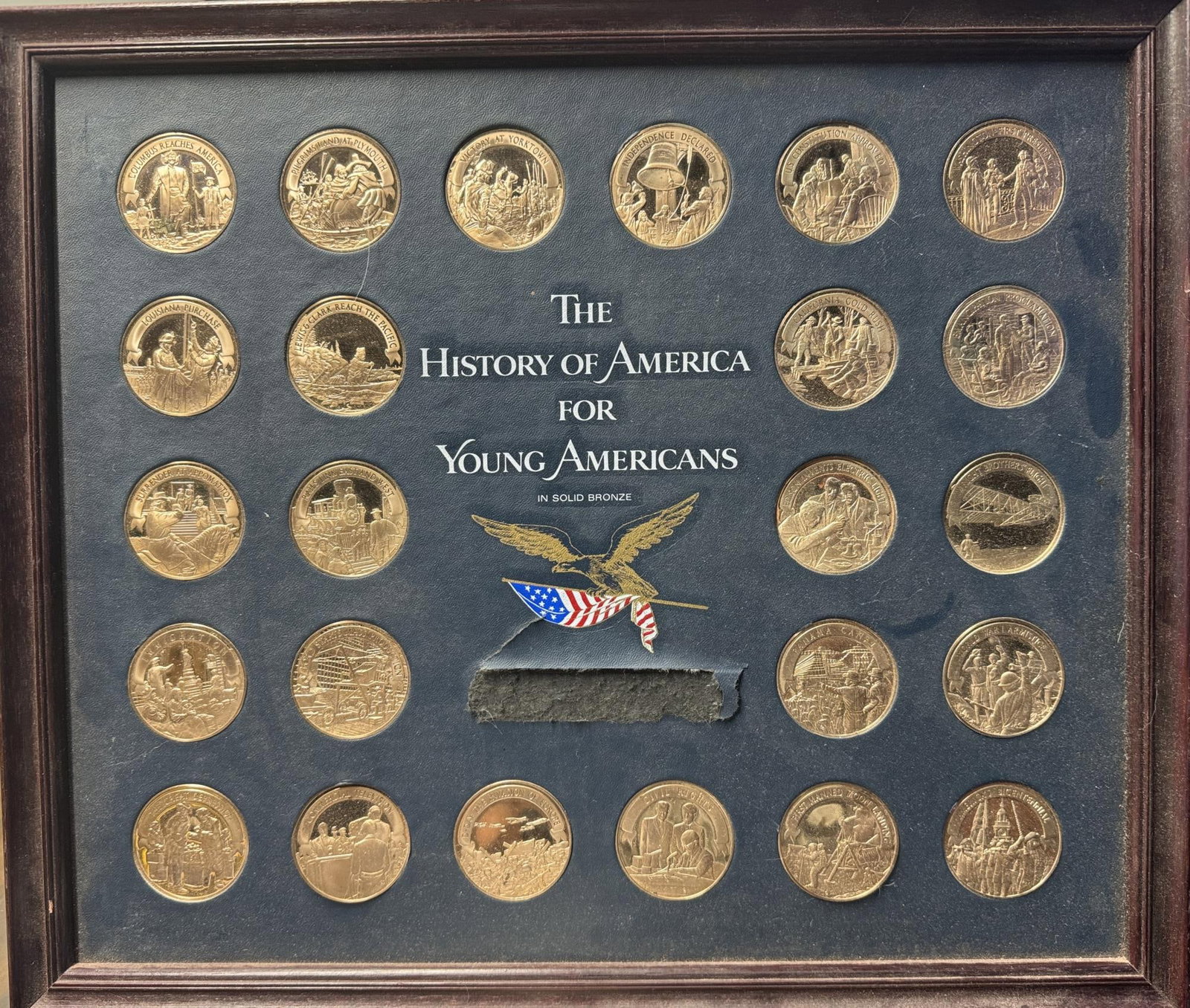 TWENTY-FOUR BRONZE HISTORY COINS: FRAMED & MATTED TWENTY-FOUR BRONZE HISTORY COINS.