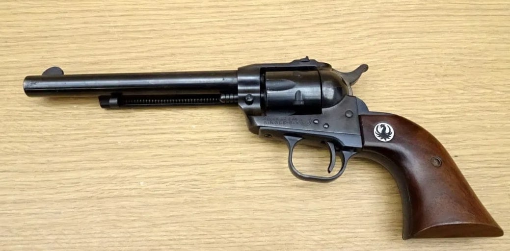 Ruger SINGLE-SIX .22 WMR Revolver.: Ruger SINGLE-SIX .22 WMR Revolver. Very Good. 6.5" Barrel. Shiny Bore, Tight Action . Features a Serrated Hammer Spur, Side Gate Loading, with a 6 Shot Fluted Cylinder. SA Only, Smooth Wood Grips with