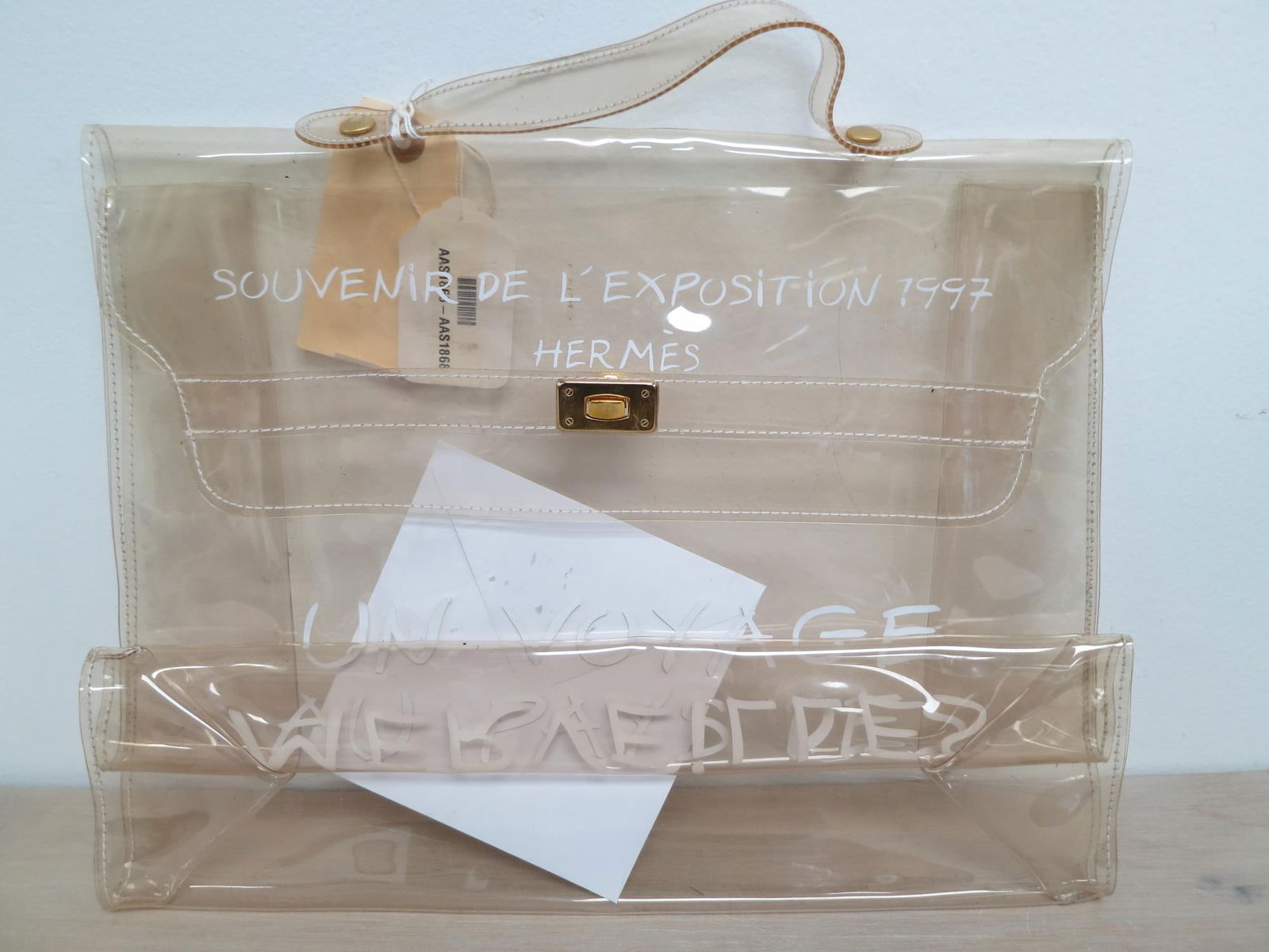 Hermès Ltd. Ed. Souvenir de L'Exposition 1997: 1997 - Un Voyage Au Pays Des Merveilles Kelly Hermes Ltd. Ed. Souvenir de L'Exposition 1997 - Un Voyage Au Pays Des Merveilles Kelly Souvenir Transparent,PVC,Transparent PVC Handle Golden Brass Hardwa