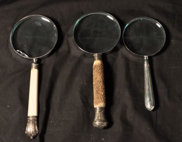 LOT OF MAGNIFYING GLASSES: OT OF MAGNIFYING GLASSES. IVORY AND STERLING, STERLING, DEERHORN AND STERLING. SOLD AS IS. Height: 10 in. by Width: 4 in. by Depth: .5 in.