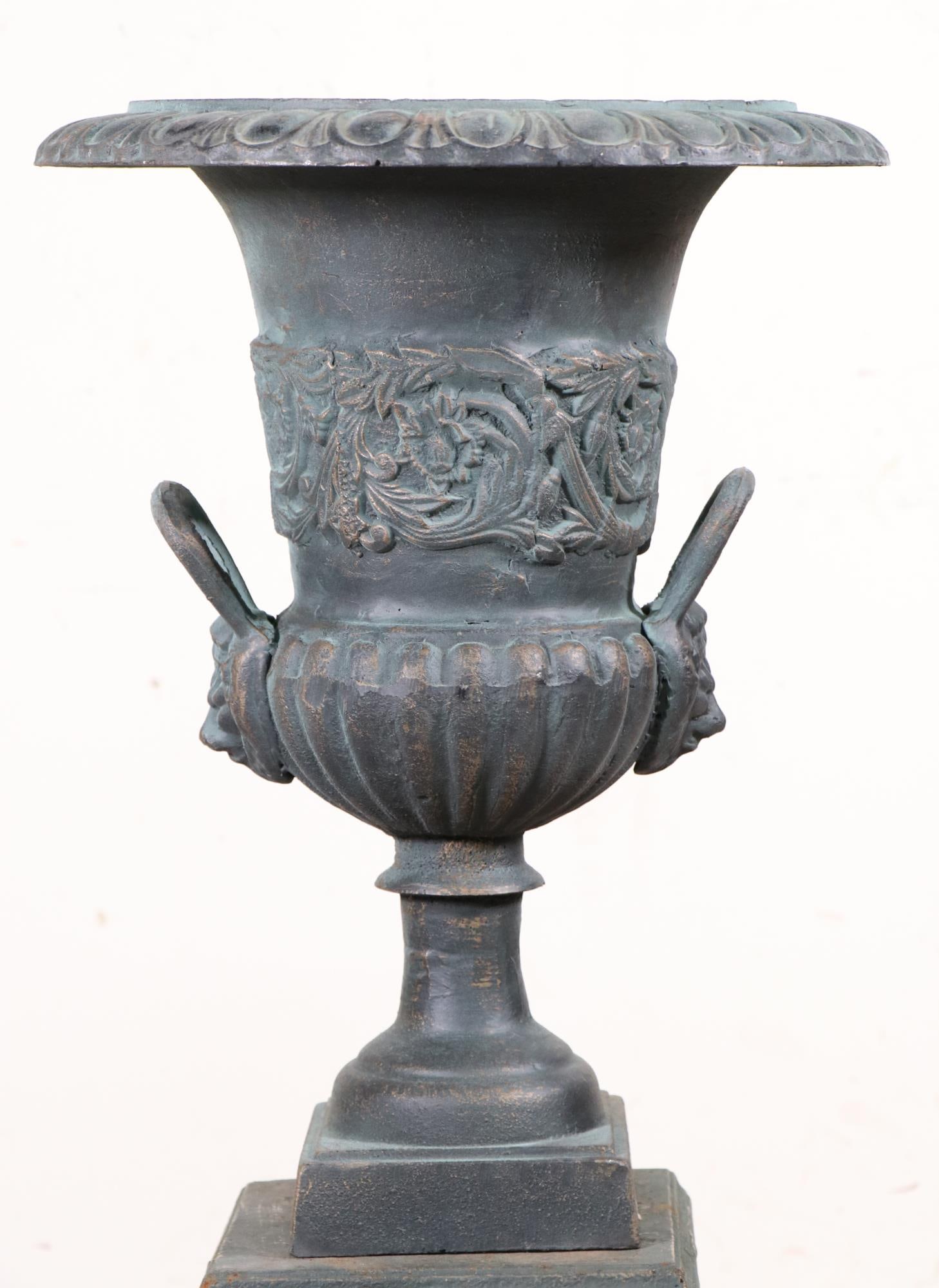 DOUBLE HANDLE CAST IRON PLANTER ON PEDESTAL: DOUBLE HANDLE CAST IRON PLANTER ON PEDESTAL.. Height: 41 in. by Width: 18 in. by Depth: 18 in