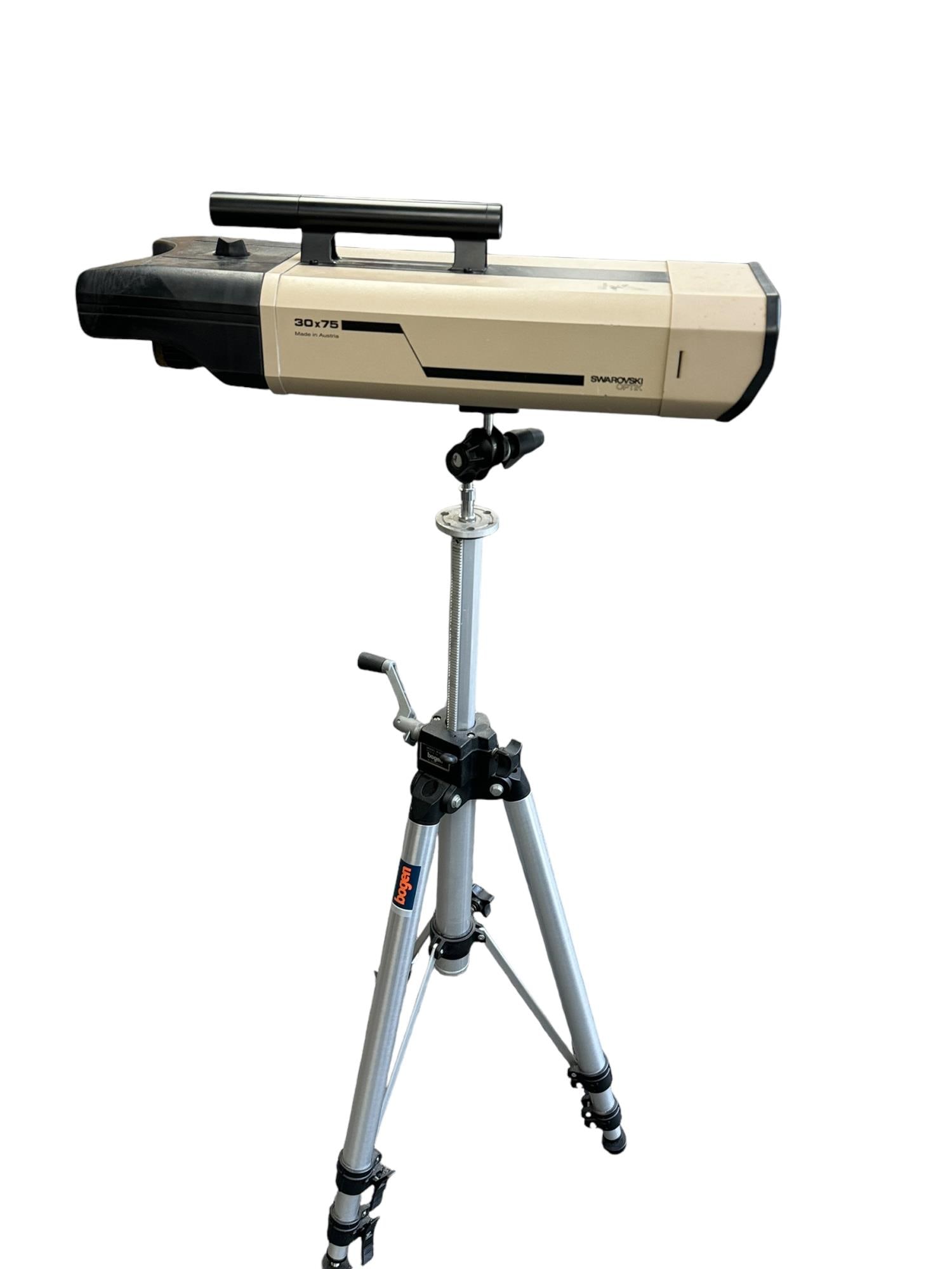 SWAROVSKI OPTIK TELESCOPE ON TRIPOD: SWAROVSKI OPTIK TELESCOPE DOPPEL SPETIV ON TRIPOD. Height: 46 in. by Width: 21 in. by Depth: 8 in.