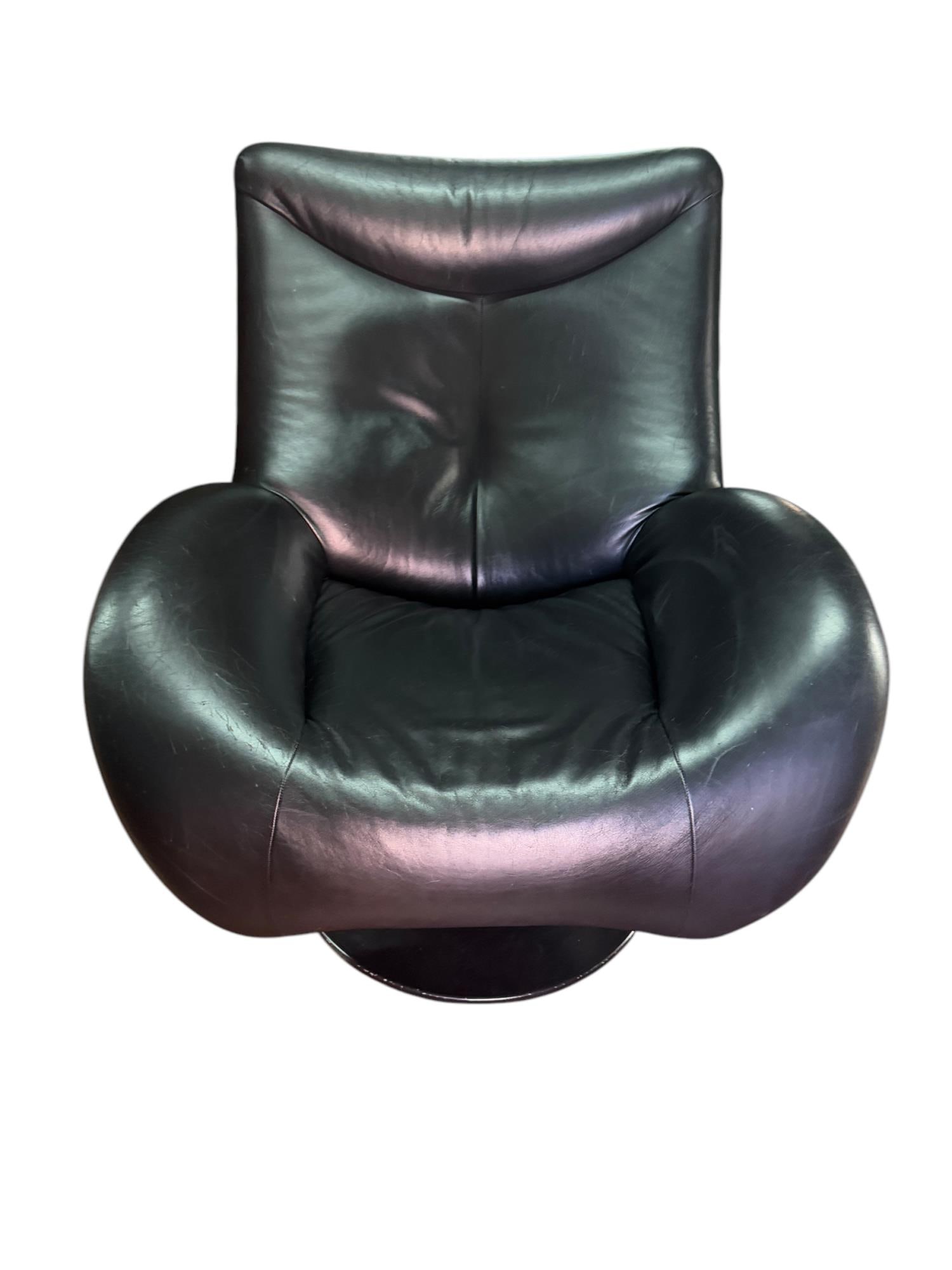 BLACK LEATHER CHAIR AND OTTOMAN: BLACK LEATHER CHAIR AND OTTOMAN Height: 36 in. by Width: 34 in. by Depth: 34