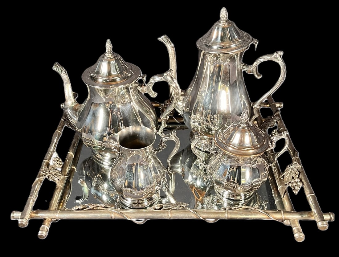 INTERNATIONAL SILVER CO. SILVER PLATE TEA SET: FIVE-PIECE INTERNATIONAL SILVER CO. SILVER PLATE TEA SET WITH TRAY. INCLUDES 1 TRAY, COFFEE & TEA POTS, SUGAR AND CREAMER. LARGEST=10"H X 9"W X 5"D. MEDIUM=9.5" X 9.5" X 6". CREAMER=5 X 4 X 3.5". TRAY