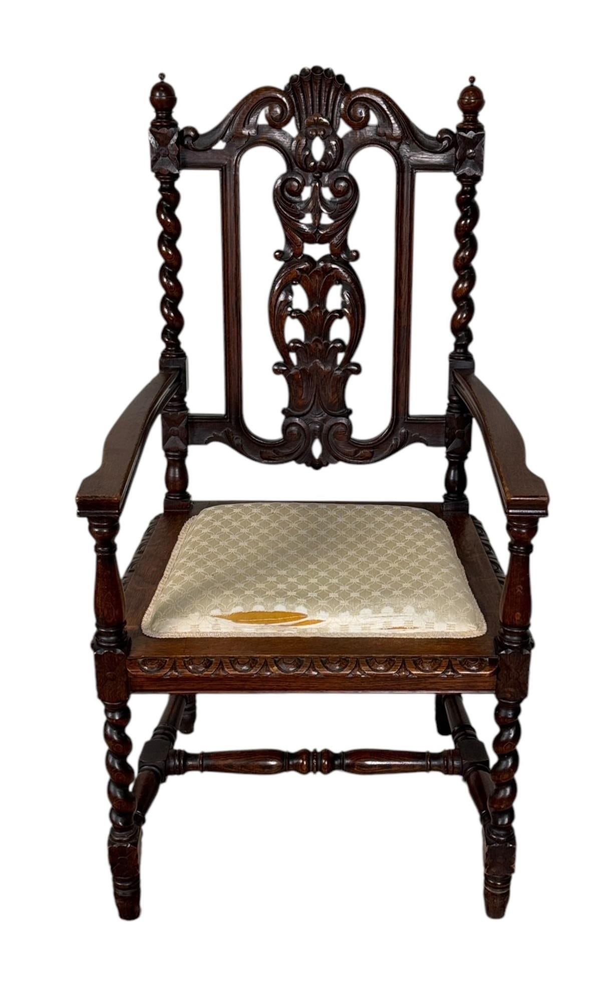 VINTAGE JACOBEAN STYLE CARVED WOOD ARMCHAIR: VINTAGE JACOBEAN STYLE CARVED WOOD ARMCHAIR. Height: 46 in. by Width: 23.8 in. by Depth: 20 in.