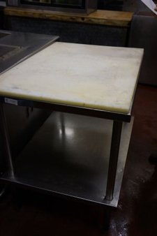 STAINLESS STEELE PREP TABLE WITH CUTTING TOP: STAINLESS STEELE PREP TABLE WITH CUTTING TOP.