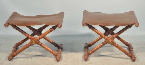 PAIR OF LEATHER SAVONAROLA FOOT STOOLS: PAIR OF LEATHER SAVONAROLA STOOLS. SLIGHT TEAR TO LEATHER SEAT, SOLD AS IS. Height: 16 in. by Width: 22 in. by Depth: 19 in.