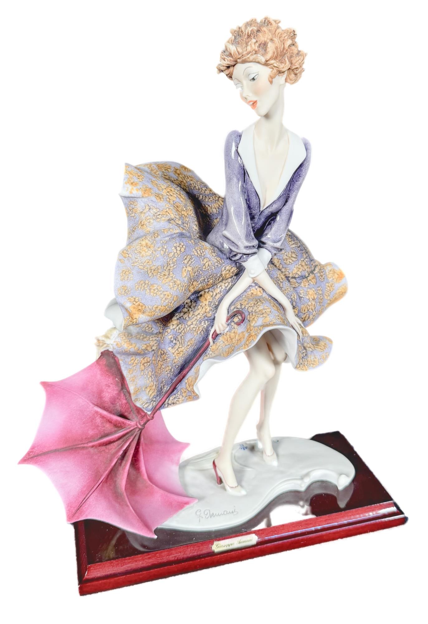 GUISEPPE ARMANI "GIRL WITH UMBRELLA" FIGURINE: GUISEPPE ARMANI "GIRL WITH UMBRELLA" FIGURINE. Height: 14.5 in. by Width: 10.5 in. by Depth: 5.5 in.