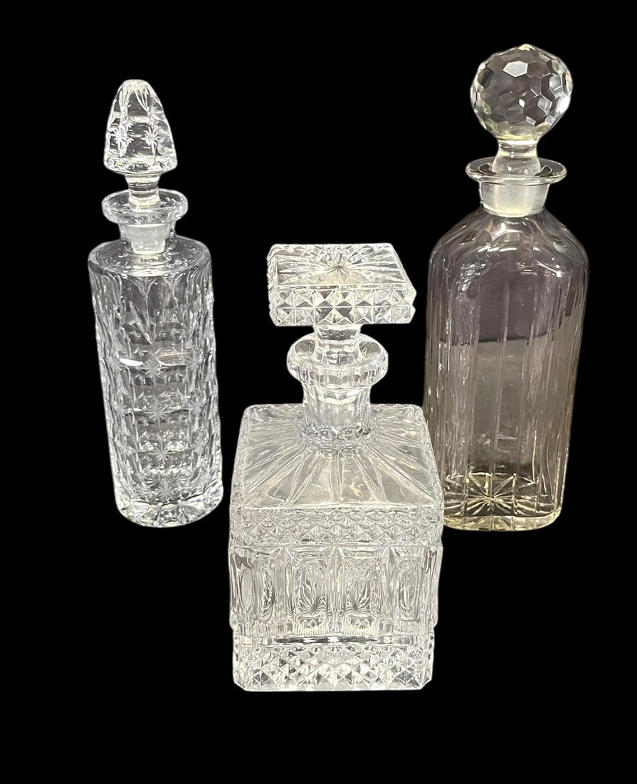 THREE CRYSTAL CUT DECANTERS (1 of 4)
