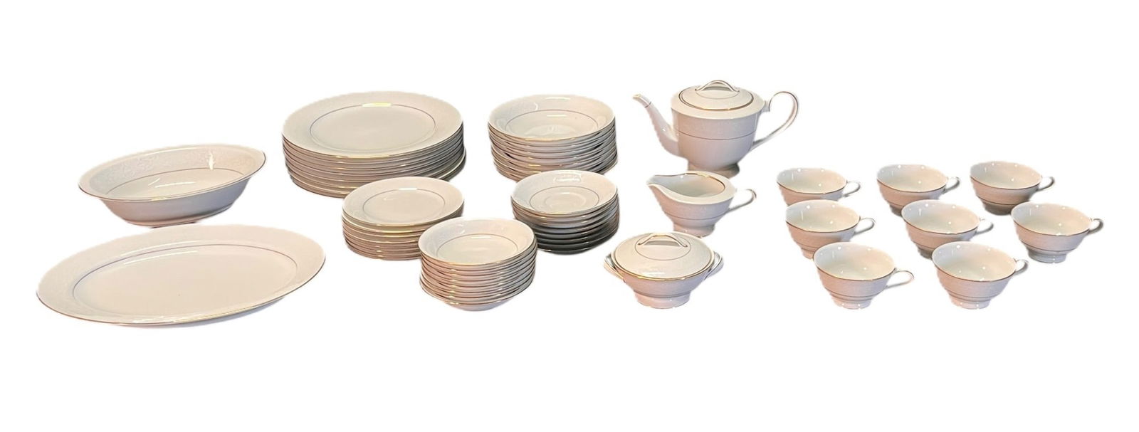 SET OF NORITAKE-JAPAN CHINA: SET OF NORITAKE JAPAN CHINA INCLUDES: 8 DINNER PLATES, 1 PLATTER, 1 SERVING BOWL. 8 SOUP BOWLS, 8 BREAD AND BUTTER PLATES, 8 DESSERT PLATES, 8 SAUCERS, 8 COFFEE CUPS. 1 PITCHER, SMALL CREAM JAR, SMALL