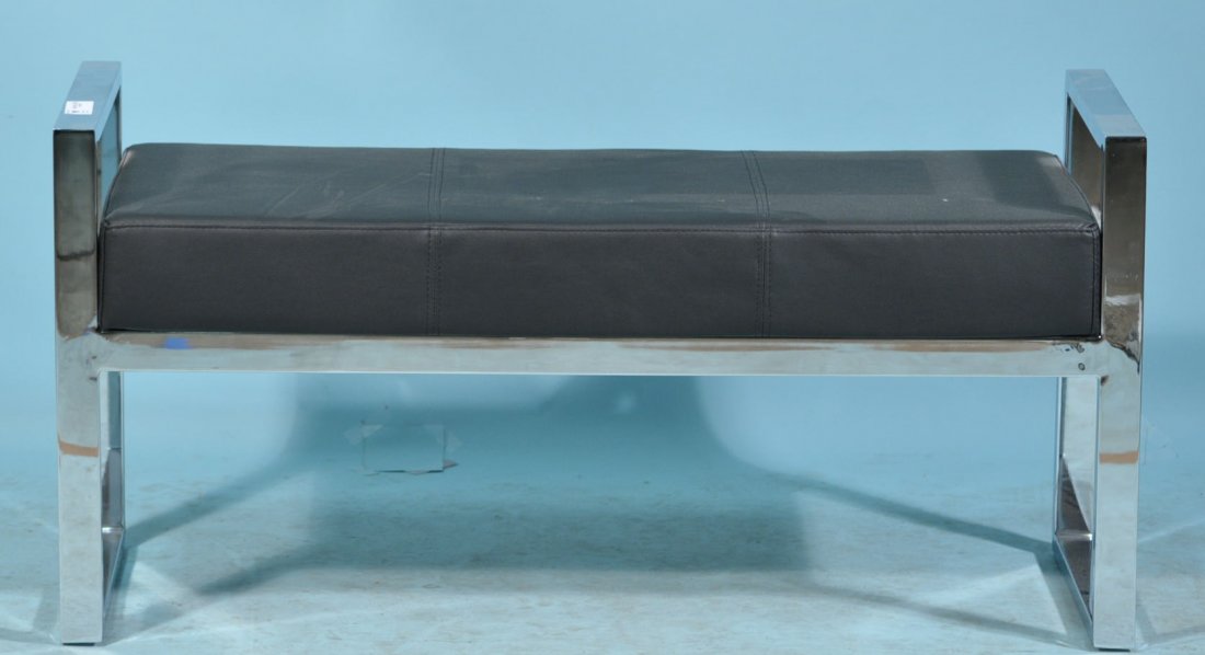 A DARBY BENCH WITH BLACK LEATHER CUSHION: A DARBY BENCH WITH BLACK LEATHER CUSHION ON A CHROME BASE. Height: 20 in. by Width: 40 in. by Depth: 14.5 in.