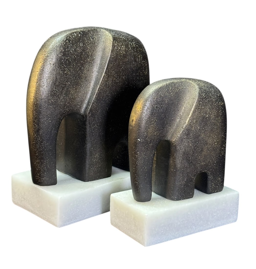 TWO BRONZE PATINA ELEPHANTS: TWO BRONZE PATINA ELEPHANTS. 9.5 & 7.5"H X 15 & 12.5"W X 6 & 5"D.