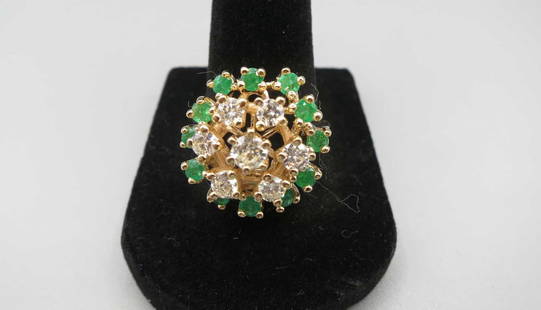 14KT YELLOW GOLD EMERALD & DIAMOND FLOWER RING: 14KT YELLOW GOLD EMERALD & DIAMOND FLOWER RING. EMERALD +/-0.50CTS, DIAMONDS+/-0.90CTS. RING=10 GRAMS T.W. SIZE 8. Height: 1/2 in. by Width: 3/4 in.
