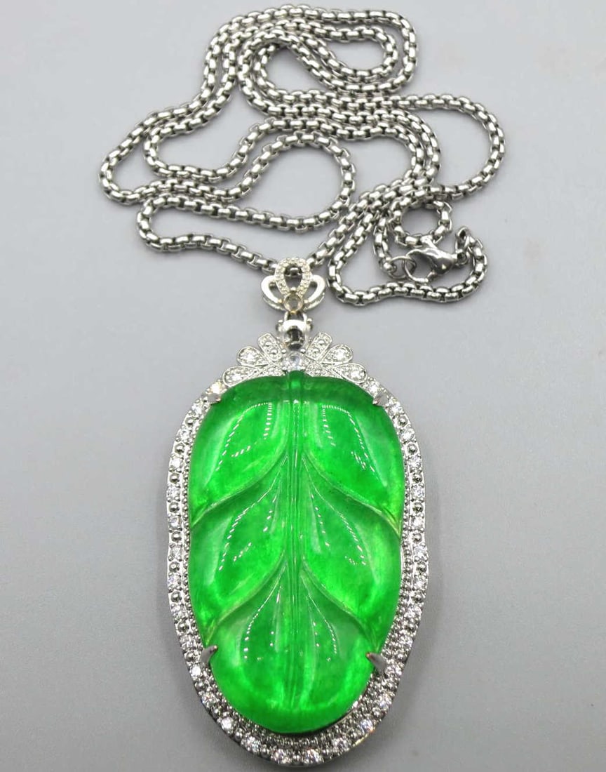 CARVED JADE LEAF PENDANT ON 22 INCH CHAIN: CARVED JADE LEAF & CZ PENDANT ON 22 INCH STERLING CHAIN. Height: 2 3/4 in. by Width: 1 3/8 in. by Depth: .5 in.