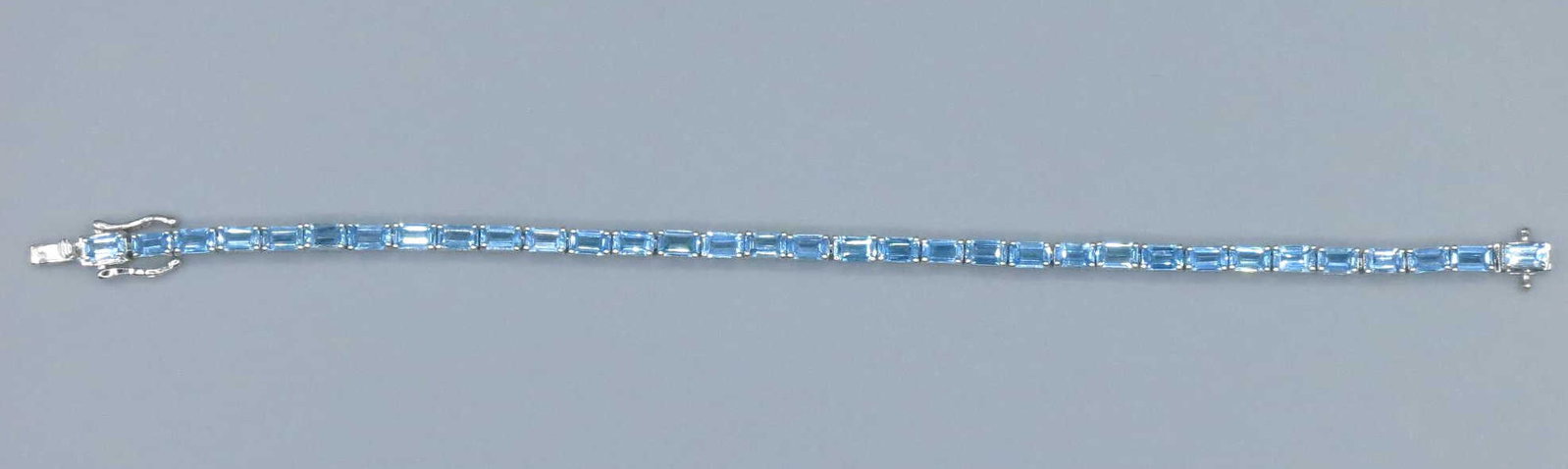 TOURMALINE STERLING SILVER BRACELET: TOURMALINE STERLING SILVER BRACELET. Height: 3/16 in. by Width: 7 in. by Depth: 1/8 in.