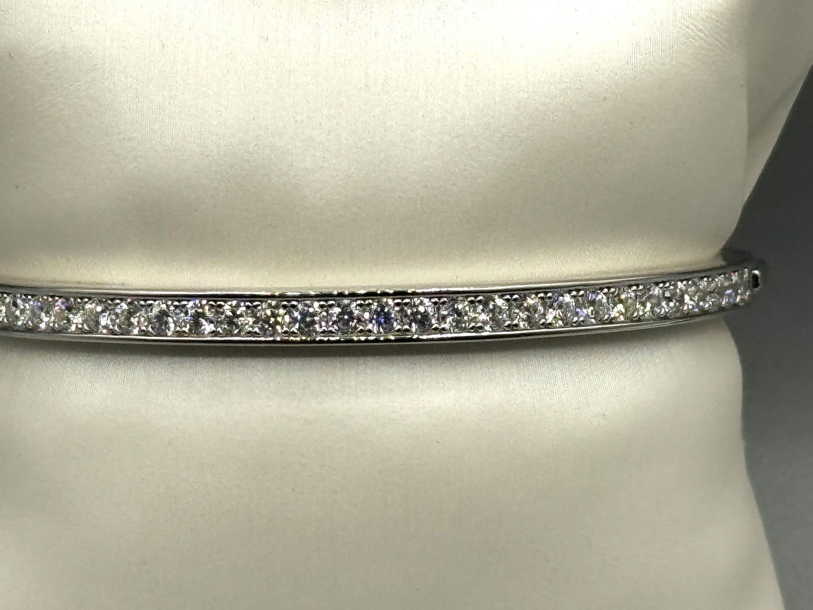 WHITE TOPAZ STERLING SILVER BANGLE BRACELET: WHITE TOPAZ STERLING SILVER BANGLE BRACELET.