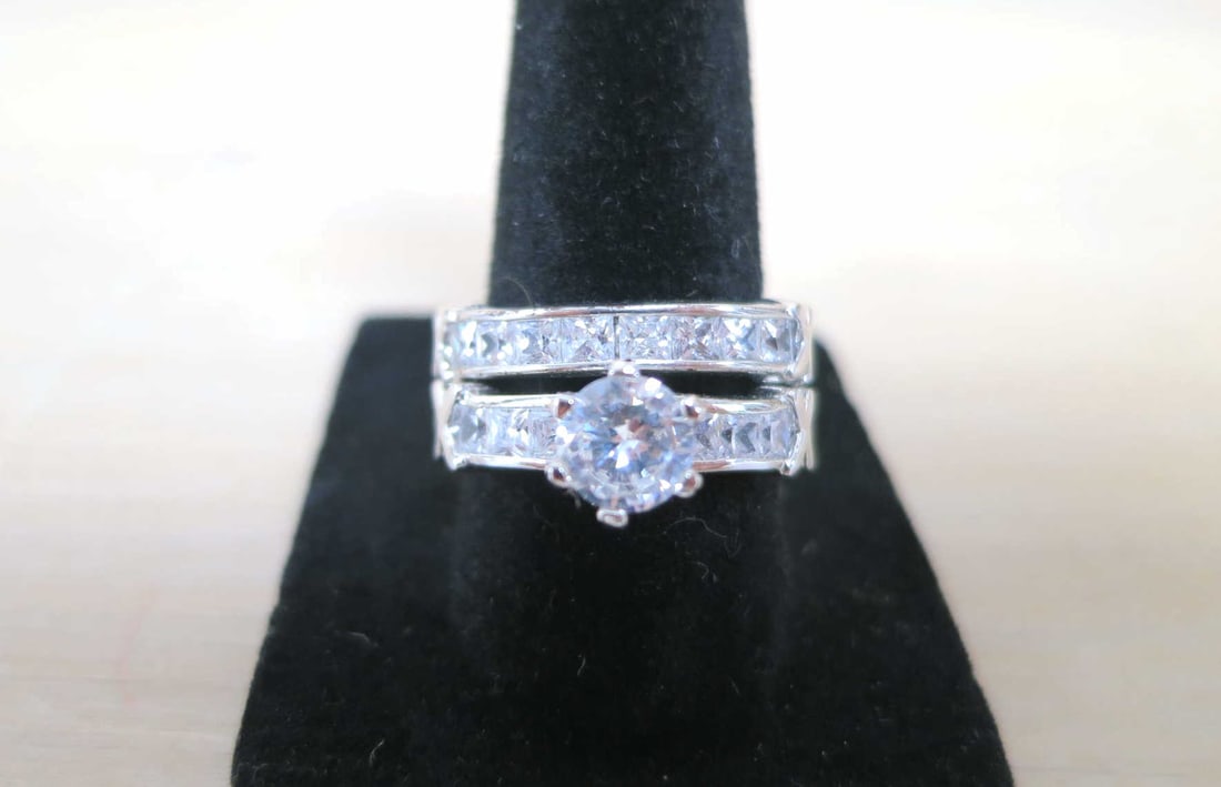 TWO-PIECE MOISSANITE STERLING SILVER WEDDING SET: TWO-PIECE MOISSANITE STERLING SILVER WEDDING SET. SIZE 7, 8.