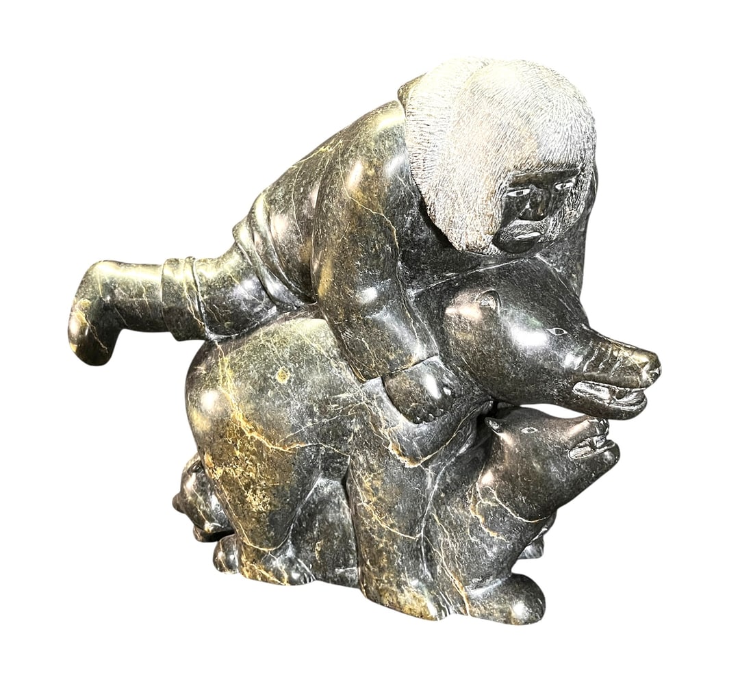 INUIT HARDSTONE CARVING OF ESKIMO WITH THREE BEARS: SOAPSTONE CARVING OF ESKIMO WITH THREE BEARS Height: 13 in. by Width: 13 in. by Depth: 9 in.