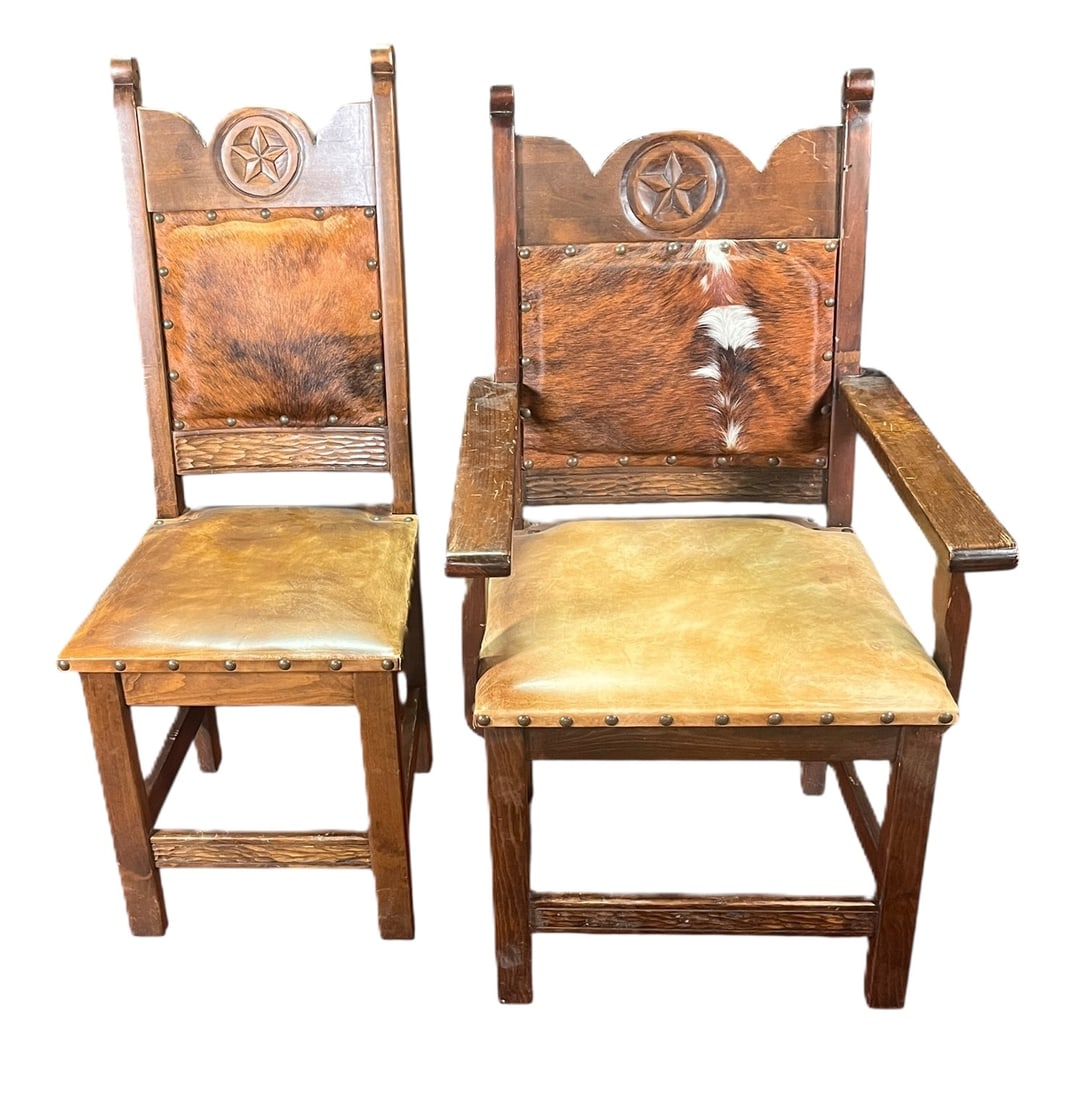 8 RANCH MOTIF CHAIRS W/ STAR OF TEXAS CARVING: RANCH MOTIF CHAIRS W/ STAR OF TEXAS CARVING AND NAILHEAD COWHIDE BACK . TWO ARMCHAIRS, 6 SIDE CHAIRS. Height: 47 in. by Width: 18 in. by Depth: 18 in.