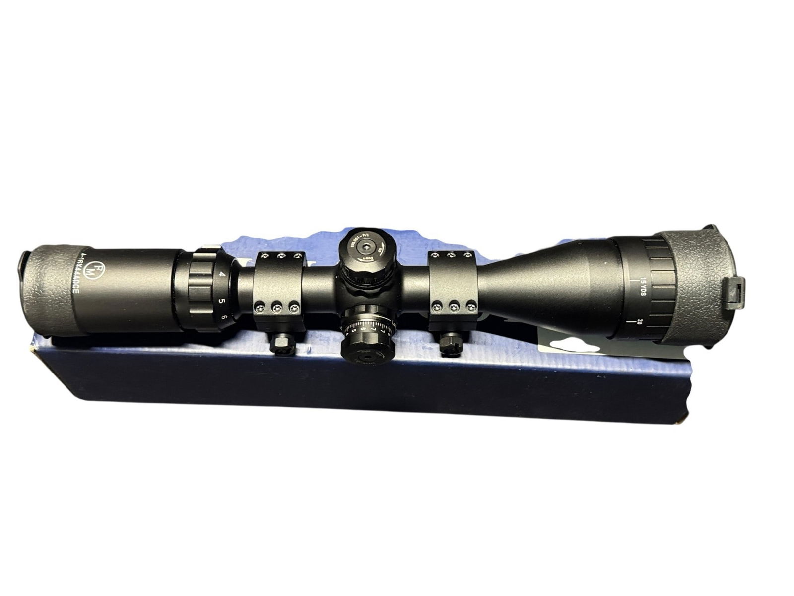 FM OPTICS RIFLESCOPE: FM OPTICS RIFLESCOPE FMTL41644AO 4-16X44 LOOKING RING IL RED/GREEN RETICLE BUBBLE LEVEL MIL-DOT BLACKMATE
