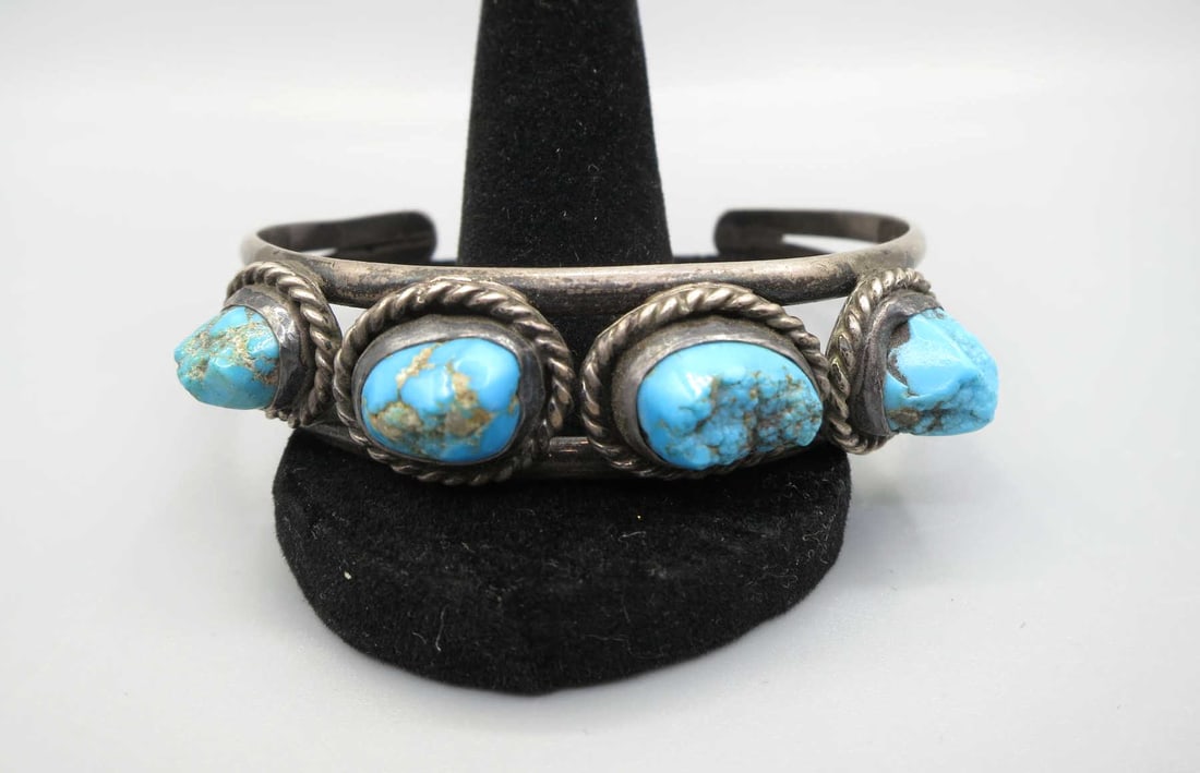 STERLING SILVER TURQUOISE CUFF BRACELET: STERLING SILVER TURQUOISE CUFF BRACELET. Height: .5 in. by Width: 2.5 & 2 3/16 in. by Depth: 2 & 1.5 in.