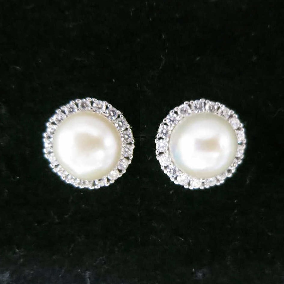 PAIR OF FAUX PEARL & PAVE SAPPHIRE STUD EARRINGS: PAIR OF FAUX PEARL & WHITE PAVE SAPPHIRE STUD EARRINGS. Height: 7/16 in. by Width: 7/16 in. by Depth: 1/4 in.