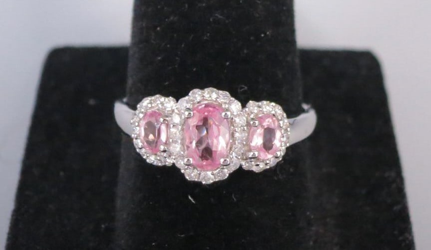 14KT WHITE GOLD PINK SPINEL & DIAMOND RING: 14KT WHITE GOLD PINK SPINEL & DIAMOND RING. 3-PINK SPINEL=0.91CTS, 34-DIAMONDS=0.27CTS. 2.63 GRAMS T.W. SIZE 7. MIN 0.48 # GJ10348R R1605432 (117)