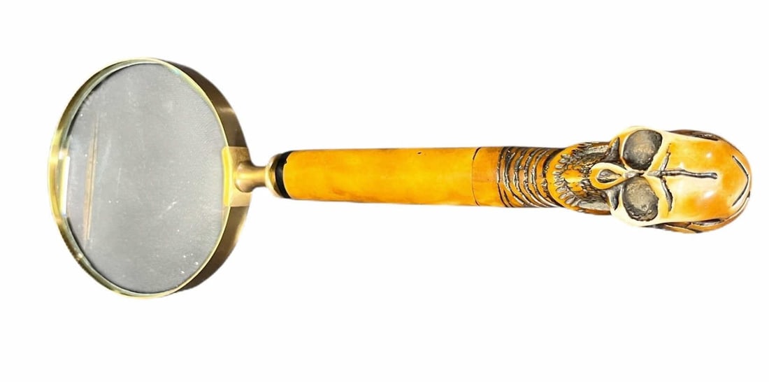 SKULL MAGNIFYING GLASS: SKULL MAGNIFYING GLASS. Height: 11 in. by Width: 4 in. by Depth: 4 in.