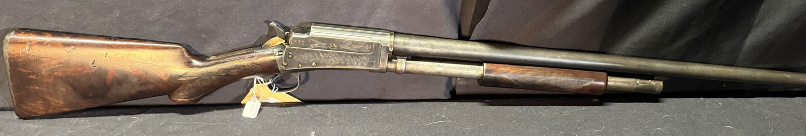 MARLIN 12 GA PUMP SHOTGUN W/HAMMER: MARLIN 12 GA PUMP SHOTGUN W/HAMMER FACTORY ENGRAVED RECEIVER WITH DUCKS & DOVE; CHECKERED FOREARM & STOCK. SERIAL #A11871.WS33/40. (L747)