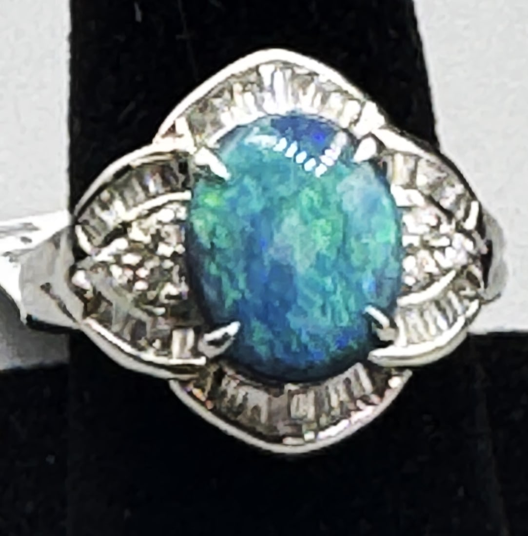 PT900 OPAL & DIAMOND RING: PT900 OPAL & DIAMOND RING. SIZE 5. PT900 8.70 GRAMS. OP 1 1.95 DIA 0.50CTS. R2200108 (80)