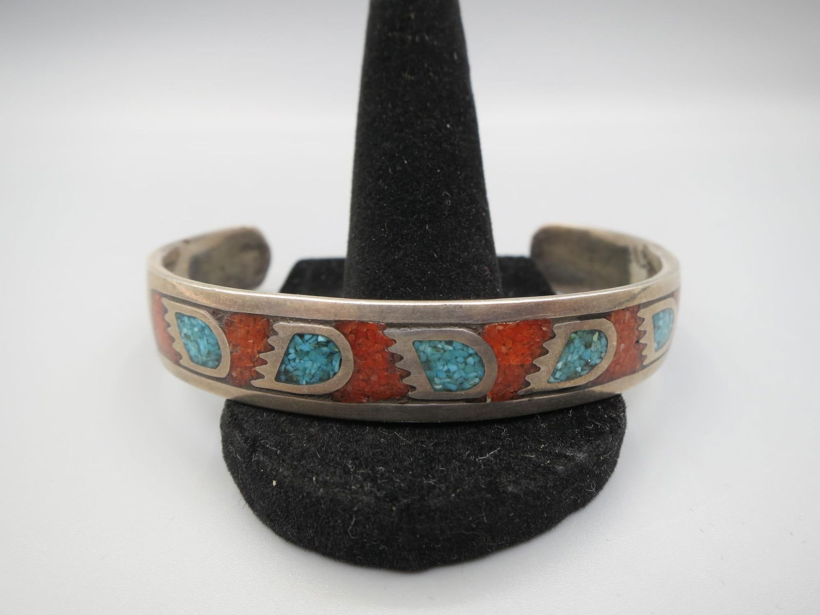 STERLING SILVER TURQUOISE & CORAL CUFF BRACELET: STERLING SILVER TURQUOISE & CORAL CUFF BRACELET. Height: 7/16 in. by Width: 2.5 & 2 3/8 in. by Depth: 2 & 1 3/4 in.