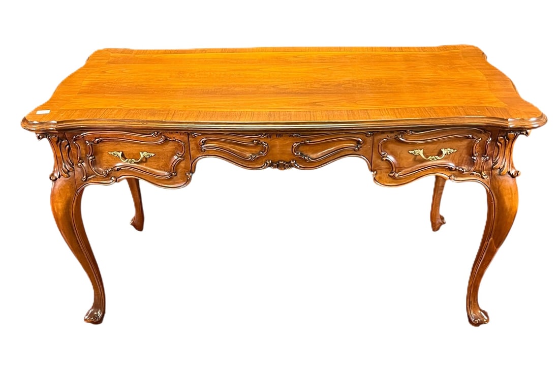 VINTAGE COUNTRY FRENCH STYLE DESK ON CABRIOLE LEGS: VINTAGE COUNTRY FRENCH STYLE MAHOGANY DESK ON CABRIOLE LEGS WITH TWO DRAWERS. 24" apron to floor. Height: 31 in. by Width: 57 in. by Depth: 28 in.