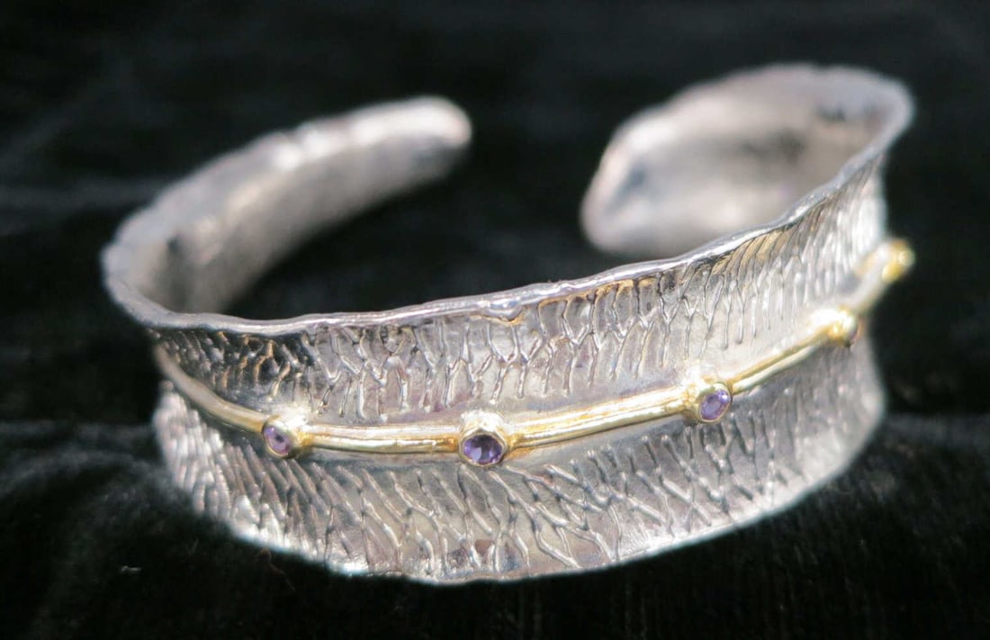 STERLING SILVER MICRO COLOR CZ LEAF MOTIF BRACELET: STERLING SILVER MICRO COLOR CZ BANGLE LEAF MOTIF BRACELET. Height: 1 in. by Width: 2.5 in. by Depth: 2 1/4 in.