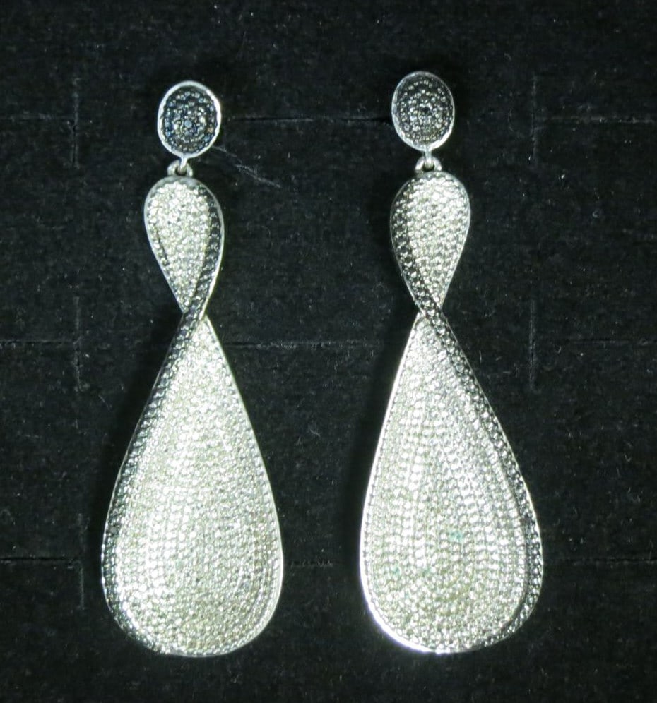 PAIR OF MICRO PAVE WHITE TOPAZ STERLING EARRINGS: PAIR OF MICRO PAVE WHITE TOPAZ STERLING EARRINGS. PIERCED EARS. Height: 2 in. by Width: 3/4 in. by Depth: 1/8 in.